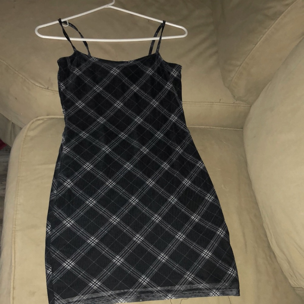This is a nice black dress from H&M. It’s a size small, with a flannel design.